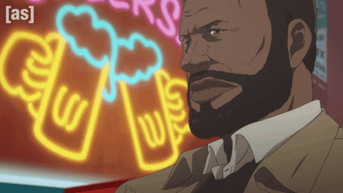 a man with a beard is standing in front of a neon sign that says [ as ] on it