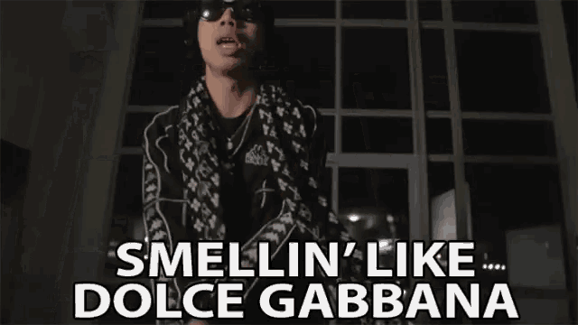 a person is holding their hands to their face and says smellin ' like dolce gabbana