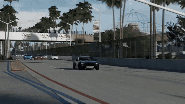 a car is driving down a highway under a bridge with a sign that says tiger