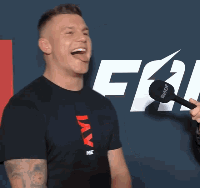 a man wearing a black t-shirt that says jay on it