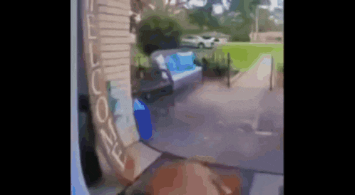 a blurry picture of a house with a sign that says welcome on it