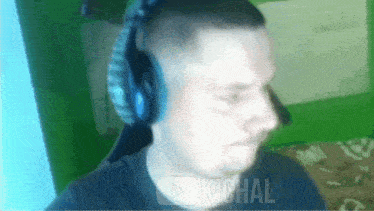 a man wearing headphones with the word kichal on the bottom of the screen