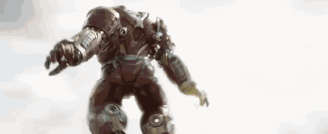 iron man is flying through the air in a blurred image .