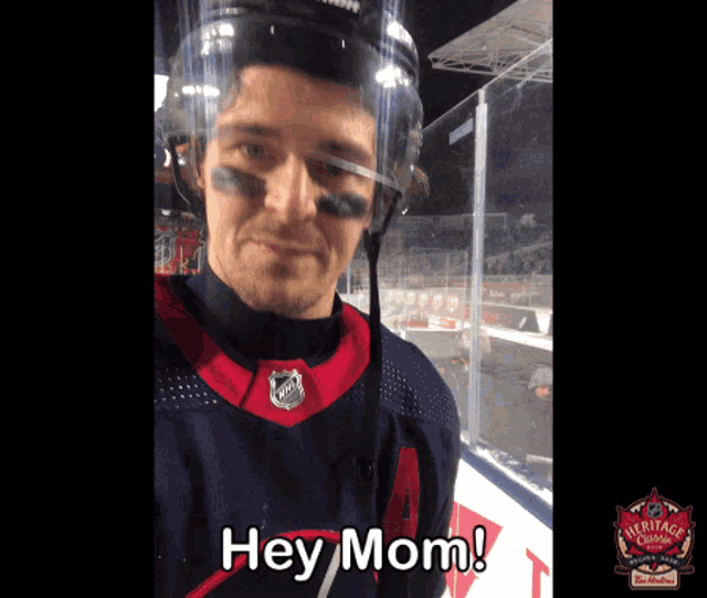 a hockey player taking a selfie with the words hey mom