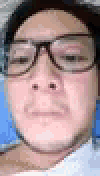 a man wearing glasses and a white shirt is looking at the camera .