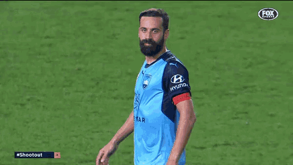 a man with a beard wearing a hyundai jersey