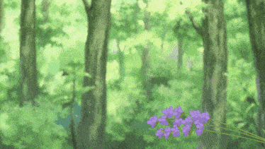 a bunch of purple flowers in a forest
