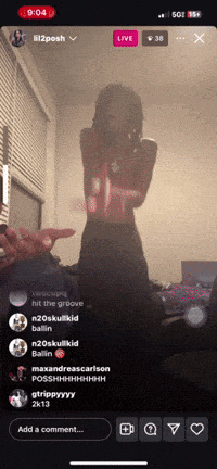 a phone screen shows a live stream of a girl dancing