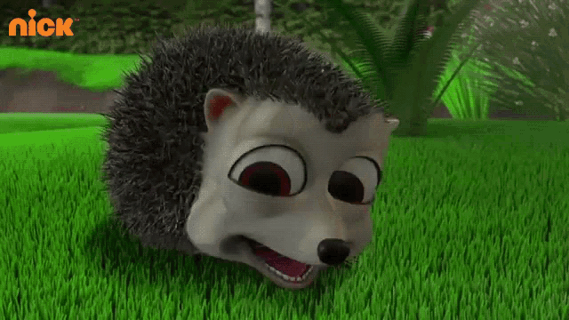 a cartoon hedgehog is standing in the grass with a nick logo behind it