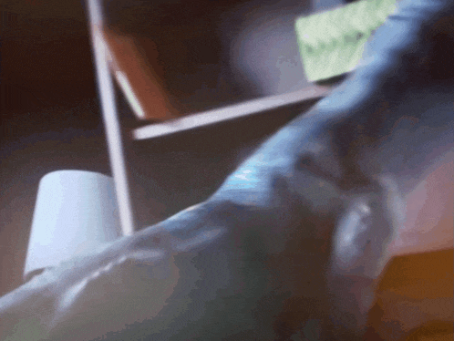 a blurred image of a person laying on a couch