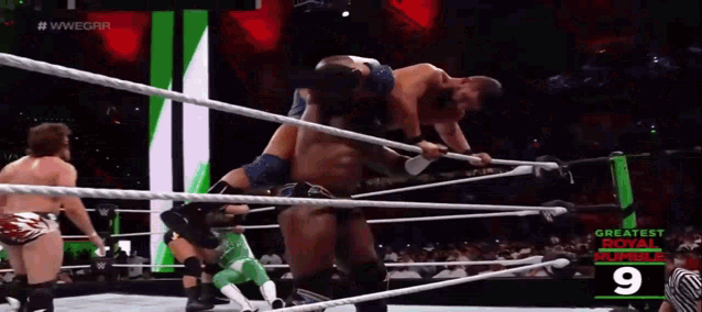 a wrestling match with the number 9 on the bottom right
