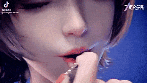 a woman is applying red lipstick to her lips with a brush .