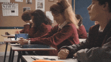 a group of students are in a classroom with the words son of a grifch on the wall