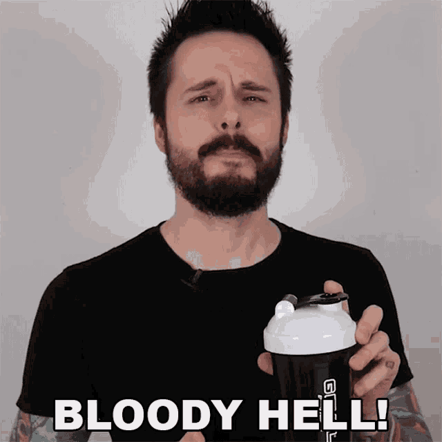 a man with a beard is holding a shaker with the words bloody hell written on it