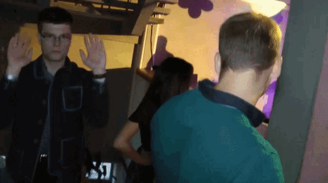 a man in a green shirt with the letter s on the back