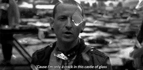 a black and white photo of a man with a crack in his eye and a quote .