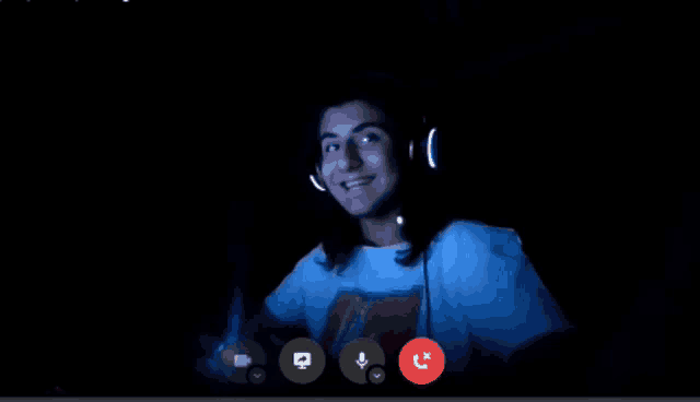 a man wearing headphones and a t-shirt that says ' rolling stones ' on it