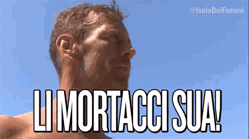 a man without a shirt is standing in front of a blue sky and says " limortacci sua "