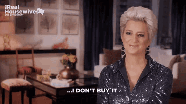 a woman says i don 't buy it in front of a real housewives logo
