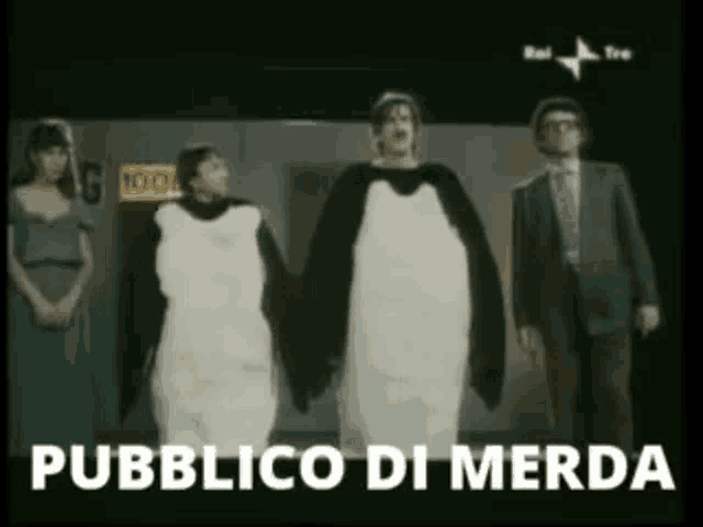 a group of people dressed in penguin costumes are standing next to each other with the words pubblico di merda above them