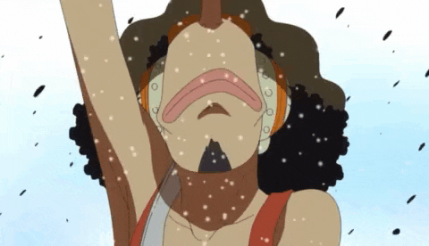 a close up of a person 's face with snow falling on them