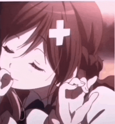a girl with a cross on her head is making a peace sign