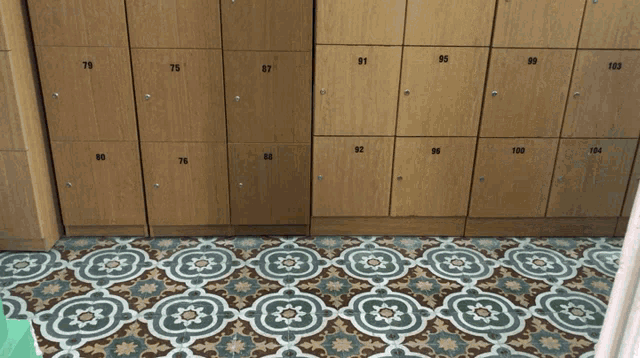 a row of wooden lockers with the numbers 79 to 100 on them