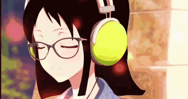 a girl wearing glasses and headphones looks at the camera
