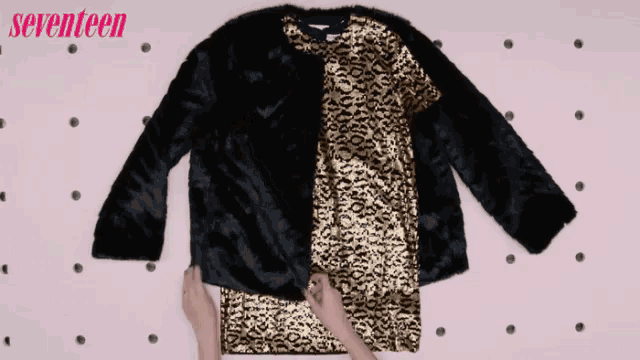 a black and gold fur coat with the word seventeen on the bottom right