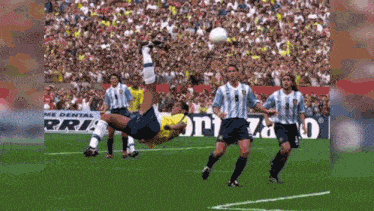 a soccer player kicks the ball in front of a sign that says dental