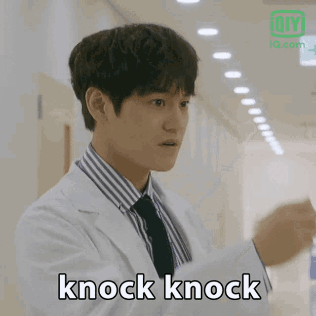a man in a lab coat and tie says " knock knock "