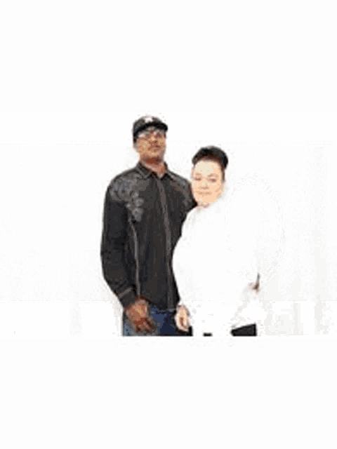 a group of people are posing for a picture in a photo booth with props .