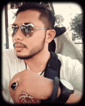 a man wearing sunglasses and a watch is taking a selfie