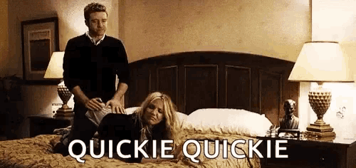 a man is putting a woman on a bed and the words quickie quickie are on the bottom