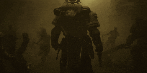 a group of people are standing in a dark room