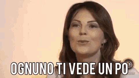 a woman in a white shirt is talking in a foreign language .