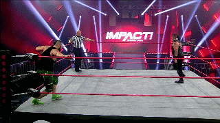 two wrestlers are in a ring with the word impact on the wall