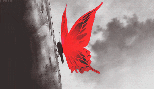 a red butterfly is flying in a black and white photo with a caption that starts with the letters g.
