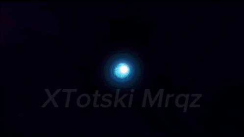 a close up of a person 's face with the word xtots on the bottom right