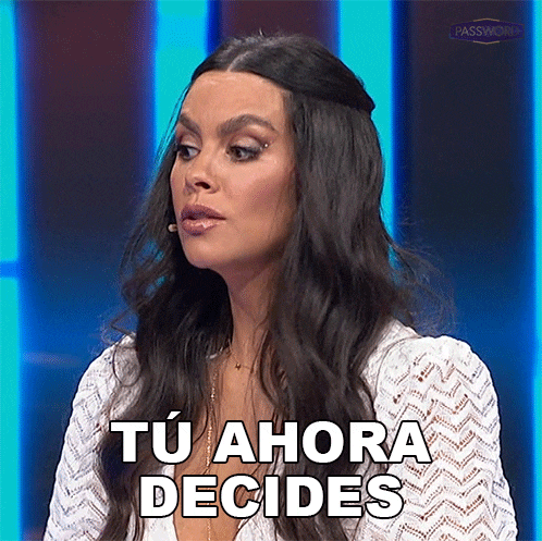 a woman with long dark hair is making a funny face and saying tu ahora decides