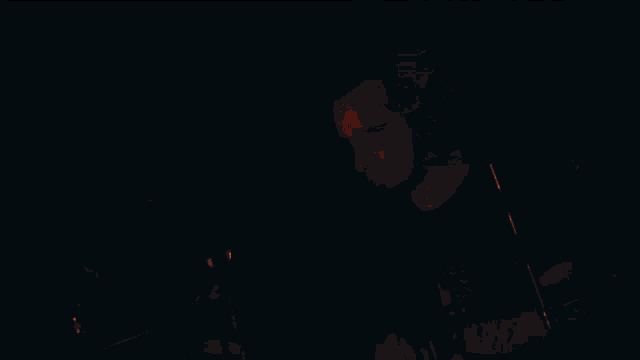 a man wearing headphones is playing drums in front of a red and black background