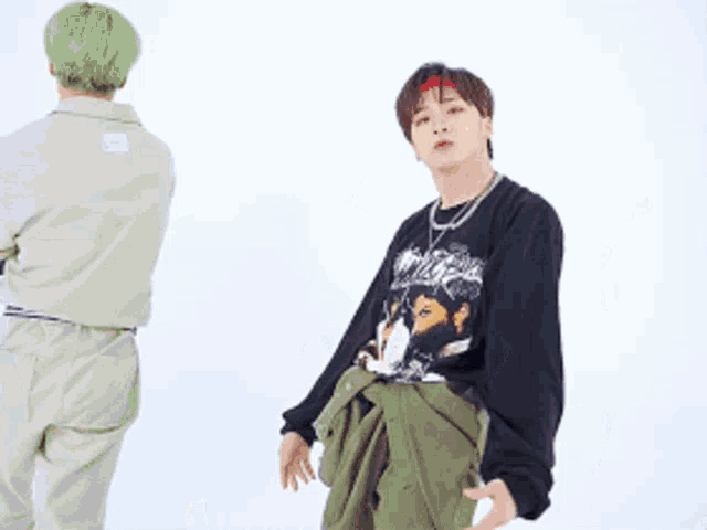 a man with green hair is standing next to another man