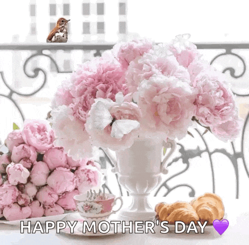 a happy mother 's day greeting card with a vase of pink flowers and croissants