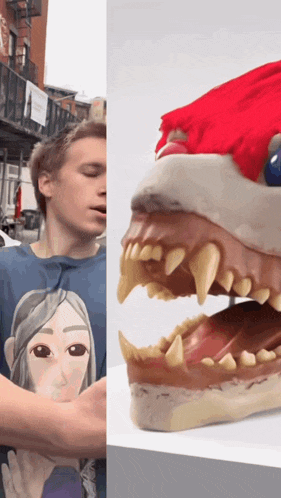 a man wearing a blue shirt with a picture of a woman on the front