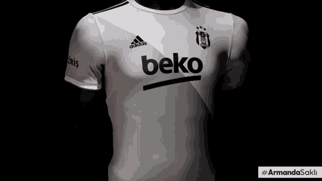 a black and white adidas shirt with the word beko on it