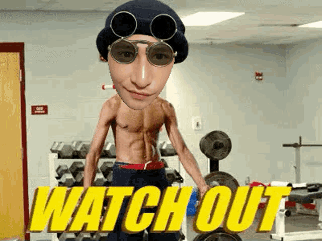 a shirtless man is standing in a gym with the words watch out above him