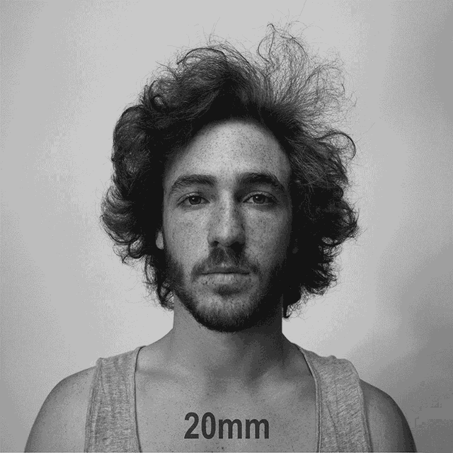 a black and white photo of a man with the words 20mm on the bottom