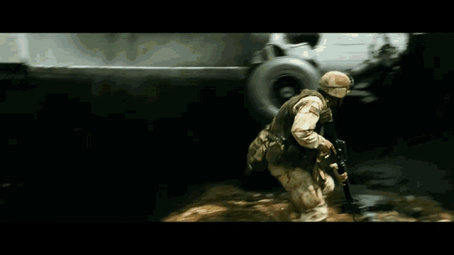 a soldier with a gun is running from a plane