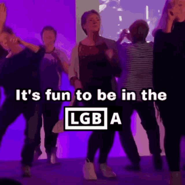 a group of people are dancing with the words it 's fun to be in the lgb a