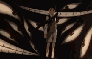 a young boy holding a gun stands in front of a monster with many eyes